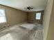 Spacious carpeted bedroom with ceiling fan and natural light from two windows at 1610 Sprayberry Dr, Marietta, GA 30066