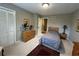 Cozy bedroom features neutral walls, wood furniture, and a red decorative rug at 1610 Sprayberry Dr, Marietta, GA 30066