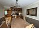 Lovely dining room features a view into the kitchen and a large mirror at 1610 Sprayberry Dr, Marietta, GA 30066