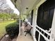 Inviting covered front porch with benches, ideal for relaxing and enjoying the outdoor scenery at 1610 Sprayberry Dr, Marietta, GA 30066