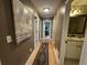 Long hallway features hardwood floors leading to multiple rooms at 1610 Sprayberry Dr, Marietta, GA 30066