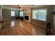 Spacious living room featuring hardwood floors, a fireplace, and abundant natural light through large windows at 1610 Sprayberry Dr, Marietta, GA 30066