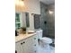 Modern bathroom featuring stylish gray tiles, modern fixtures, and a vanity at 539 Rue Montaigne, Stone Mountain, GA 30083