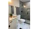 Modern bathroom features a glass shower, white vanity, and stylish fixtures at 539 Rue Montaigne, Stone Mountain, GA 30083