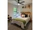 bedroom with single bed, window, and ceiling fan at 539 Rue Montaigne, Stone Mountain, GA 30083