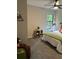 bedroom with ceiling fan, single bed, and window at 539 Rue Montaigne, Stone Mountain, GA 30083