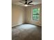 The bedroom features plush carpet, neutral paint, and a window with natural light at 539 Rue Montaigne, Stone Mountain, GA 30083