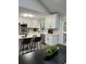 Modern kitchen with white cabinets, stainless steel appliances, and bar seating at the island at 539 Rue Montaigne, Stone Mountain, GA 30083