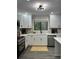 Well-lit kitchen with stainless steel appliances, bright countertops, and ample cabinet space at 539 Rue Montaigne, Stone Mountain, GA 30083