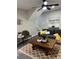 Inviting living room with modern furniture, ceiling fan, and a staircase in the background at 539 Rue Montaigne, Stone Mountain, GA 30083