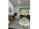 Well-lit living room with bay window, modern decor, and stylish flooring at 539 Rue Montaigne, Stone Mountain, GA 30083