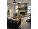 Living room featuring a stone fireplace, comfortable seating, and abundant natural light at 539 Rue Montaigne, Stone Mountain, GA 30083