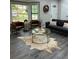 Cozy living area featuring bay window, decor, comfortable seating, and stylish flooring at 539 Rue Montaigne, Stone Mountain, GA 30083