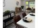 Open-concept kitchen and living room, featuring stylish decor, gray flooring, and dining space at 539 Rue Montaigne, Stone Mountain, GA 30083