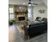 Spacious living room with a stone fireplace, decorative mantle, and stylish furnishings at 539 Rue Montaigne, Stone Mountain, GA 30083