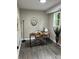 Bright home office featuring wood laminate floors, neutral walls, and a modern desk at 539 Rue Montaigne, Stone Mountain, GA 30083