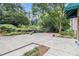 Lush backyard with mature trees, greenery and an outdoor lounge area at 2965 Pharr Nw Ct # 714, Atlanta, GA 30305