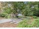 Backyard featuring walking paths, trees and stairs leading up to the building at 2965 Pharr Nw Ct # 714, Atlanta, GA 30305
