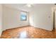 Bedroom with parquet floors, ceiling fan, and a large window at 2965 Pharr Nw Ct # 714, Atlanta, GA 30305