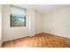 Empty bedroom featuring parquet floors and sunlit window at 2965 Pharr Nw Ct # 714, Atlanta, GA 30305