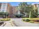 Apartment building exterior featuring a covered entrance and landscaped grounds at 2965 Pharr Nw Ct # 714, Atlanta, GA 30305