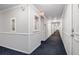 Long hallway with carpeted floor, access to units and an exit sign at 2965 Pharr Nw Ct # 714, Atlanta, GA 30305