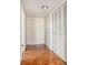 Entry hallway with parquet floors and white closet with louvered doors at 2965 Pharr Nw Ct # 714, Atlanta, GA 30305