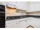 Bright kitchen with white cabinets and a gas stovetop at 2965 Pharr Nw Ct # 714, Atlanta, GA 30305