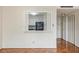 Open kitchen view from living room, with white cabinets and appliances at 2965 Pharr Nw Ct # 714, Atlanta, GA 30305
