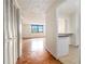 Sunlit living room with parquet floors and direct access to kitchen at 2965 Pharr Nw Ct # 714, Atlanta, GA 30305