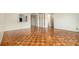 Open-concept living space with hardwood floors and view into the kitchen at 2965 Pharr Nw Ct # 714, Atlanta, GA 30305