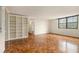 Large, open living room with bright window and built-in shelving at 2965 Pharr Nw Ct # 714, Atlanta, GA 30305