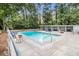 Community pool surrounded by lounge chairs and well-maintained landscaping at 2965 Pharr Nw Ct # 714, Atlanta, GA 30305