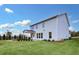 Home exterior showcasing a well-maintained backyard with a fire pit and manicured landscaping at 5390 Julep Ct, Cumming, GA 30028