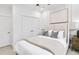 Bright bedroom with a ceiling fan, large bed and neutral accents at 5390 Julep Ct, Cumming, GA 30028
