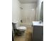 Bathroom featuring a shower-tub combo, toilet, and sink at 210 Ormond Sw St, Atlanta, GA 30315