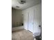 Bathroom with tiled floor, white tub and shower, and toilet at 210 Ormond Sw St, Atlanta, GA 30315