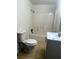 Simple bathroom with a white tub/shower combo, white toilet, and modern vanity at 210 Ormond Sw St, Atlanta, GA 30315
