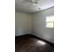 Clean bedroom featuring dark floors and simple window at 210 Ormond Sw St, Atlanta, GA 30315