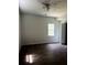 Light-filled bedroom featuring stylish dark floors and a fan at 210 Ormond Sw St, Atlanta, GA 30315