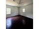 Bright bedroom with hardwood flooring, fresh, neutral paint, and bright, double-hung windows at 210 Ormond Sw St, Atlanta, GA 30315