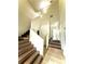 Bright entryway features wood stairs and tiled flooring, creating an inviting space at 210 Ormond Sw St, Atlanta, GA 30315