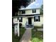 Inviting two-story home with light yellow siding and black shutters at 210 Ormond Sw St, Atlanta, GA 30315