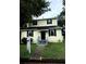 Charming two-story home with a front porch and tidy landscaping at 210 Ormond Sw St, Atlanta, GA 30315
