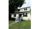 Charming two-story home with a front porch and tidy landscaping at 210 Ormond Sw St, Atlanta, GA 30315
