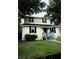 Charming two-story home with a well-maintained front yard and inviting entryway at 210 Ormond Sw St, Atlanta, GA 30315
