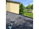 View of a roof with trees and a building in the background at 210 Ormond Sw St, Atlanta, GA 30315