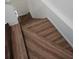 A staircase with elegant wood-look laminate flooring at 210 Ormond Sw St, Atlanta, GA 30315