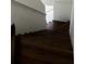 View of dark wood stairs with white banister leading to the upper level of the home at 210 Ormond Sw St, Atlanta, GA 30315