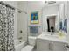 Bathroom featuring a shower with a patterned curtain, modern fixtures, and clean design at 215 Arizona Ne Ave # 3, Atlanta, GA 30307